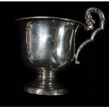 A French silver footed cup, with foliate handle, Christofle centurion marks, height 13cm, weight