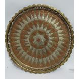 A large brass, copper and white metal middle eastern tray with shaped pierced border, diameter 53cm.