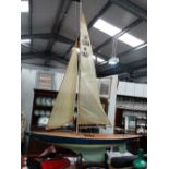 A mid 20th century large scale racing pond yacht, of plank construction with aluminium main mast and