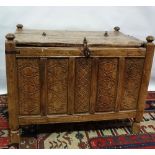 An Indian carved hardwood storage chest, the front with five floral chip carved panels, height 64cm,