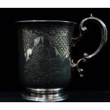 A silver christening mug, with Persian style engraved decoration and monogrammed cartouche, London