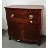 An early 19th century bow front cupboard with brass handles and raised on bracket feet, width 71cm.