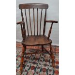 A Victorian style stickback Windsor armchair.