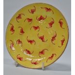 A Chinese porcelain kangxi mark saucer dish decorated with bats in iron red with gilt highlights