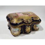 A good 19th century Sevres casket, the hinged lid with a finely gilded cartouche of two ladies and a