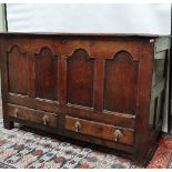 An 18th century oak coffer with four arcaded panels above two drawers, the interior fitted a