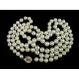 A long pearl necklace with 14ct gold Chinese emblem clasp, length 88cm.