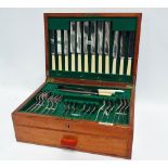 A part set of Harrods silver plated cutlery in fitted walnut case.