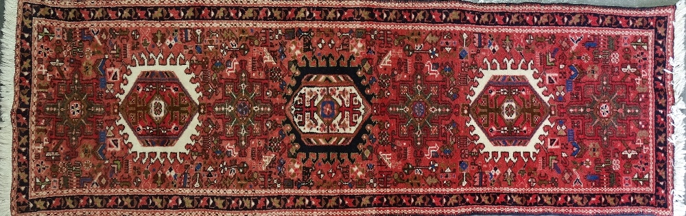 A late 20th century Karaga wool runner with seven medallions, 190 x 60cm.