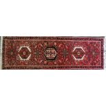 A late 20th century Karaga wool runner with seven medallions, 190 x 60cm.