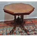 A Victorian hexagonal walnut centre table, the top marquetry inlaid with a band of ivy above a
