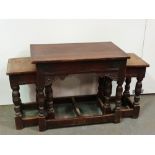 A Tudor style oak table and two stools with turned frames, height of table 50cm, width of table