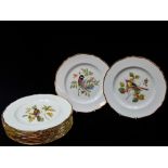 A set of twelve 20th century Spode 'Audubon Birds' hand painted and gilt decorated plates,