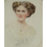 An Edwardian watercolour, an oval portrait of a young lady, indistinctly signed, framed and