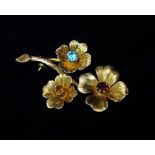 A modern 9ct gold flower brooch set aquamarine, citrine and garnet, length 54mm, weight 8.1g