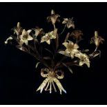 A French gilt bronze three branch wall light in the form of a bunch of lilies tied with a ribbon