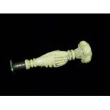 A 19th century ivory, white metal and brass seal, the handle in the form of conjoined hands, the