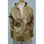 A gold lame high necked top with fold over cuff sleeves and back zip, label for 'Male by Paul