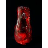 A Whitefriars 'Knobbly' ruby red vase designed by William Wilson and Harry Dyer, height 18.5cm.