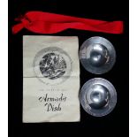 Two silver Armada style dishes, London 1963, diameter 9.3cm, weight 2.98oz approximately.