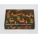 A 20th century Kashmir lacquered and painted box and cover, decorated with a forest hunting scene,