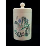 An early 20th century Japanese ivory jar and cover, the body engraved with a mountain village