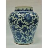 An 18th century Chinese porcelain blue and white baluster shaped jar decorated with flowering