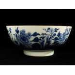 A late 18th century Chinese blue and white porcelain footed bowl decorated with chrysanthemums and