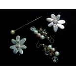 A pair of white metal flowerhead earrings, a yellow metal pearl set stickpin and a pair of costume