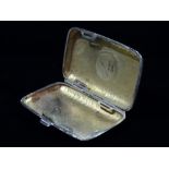 A silver cigarette case, Birmingham 1915, weight 1.9oz approximately.