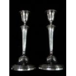 A pair of silver filled candlesticks with bands of laurel leaf decoration, Birmingham 1960, height