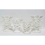 A group of four continental blanc de chine flower encrusted vases, largest height 15.5cm.