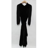 A ladies black velvet full length dress, with balloon black chiffon floral embroidered sleeves,