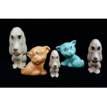 Two Sylvac Bonzo dog figurines, height of largest 18cm, together with three graduated spaniel