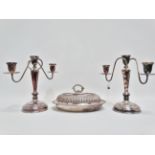 A pair of three branch silver plated candelabra, height 28cm, together with an entree dish.