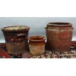 Three terracotta garden planters, largest height 33cm.