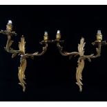 A pair of gilt bronze twin branch wall lights in Rococo style, height 40cm.