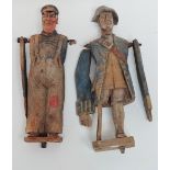 A pair of 20th century carved wood automaton figures with polychrome decoration, height 38cm (AF).