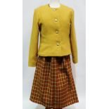 A ladies 1960s tweed three piece dog tooth pattern skirt suit, label for Connekew Couture, size 12/