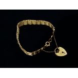 A 9ct gold gatelink bracelet with padlock clasp, weight 15.4g.