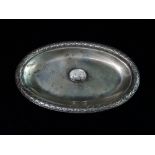 A late 19th century Scandinavian silver oval dish with laurel leaf border, centrally set with a gold