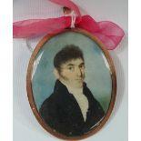MINIATURE - A fine early 19th century oval miniature on ivory of a young gentleman in a cravat and