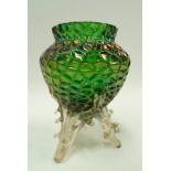 A Loetz style green iridescent glass vase raised on three naturalistic branch style feet, height