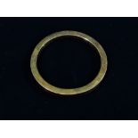A 9ct gold square section hollow bangle, 24.4g.