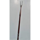 A Georgian Irish mahogany and iron peat fork, circa 1800. Length 95cm.