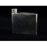 A silver hip flask in the form of a ship's rudder, with bark effect lid, London 1979, maker's mark