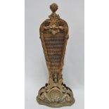 A late 19th century style brass metamorphic fire screen, with shell and foliate decorated frame and