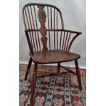 A 19th century elm, ash and fruitwood Windsor armchair with turned H stretcher.