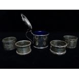 Five silver napkin rings, weight 5.81oz appoximately, together with a mustard pot with blue glass