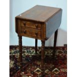 A 19th century mahogany and crossbanded drop leaf work table, fitted two drawers above ring turned